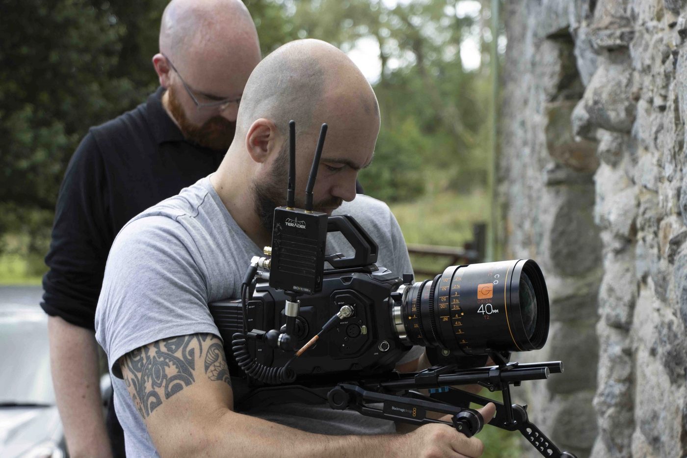 Interviewing a FixFirm spokesperson with a Blackmagic cinema camera and boom mic