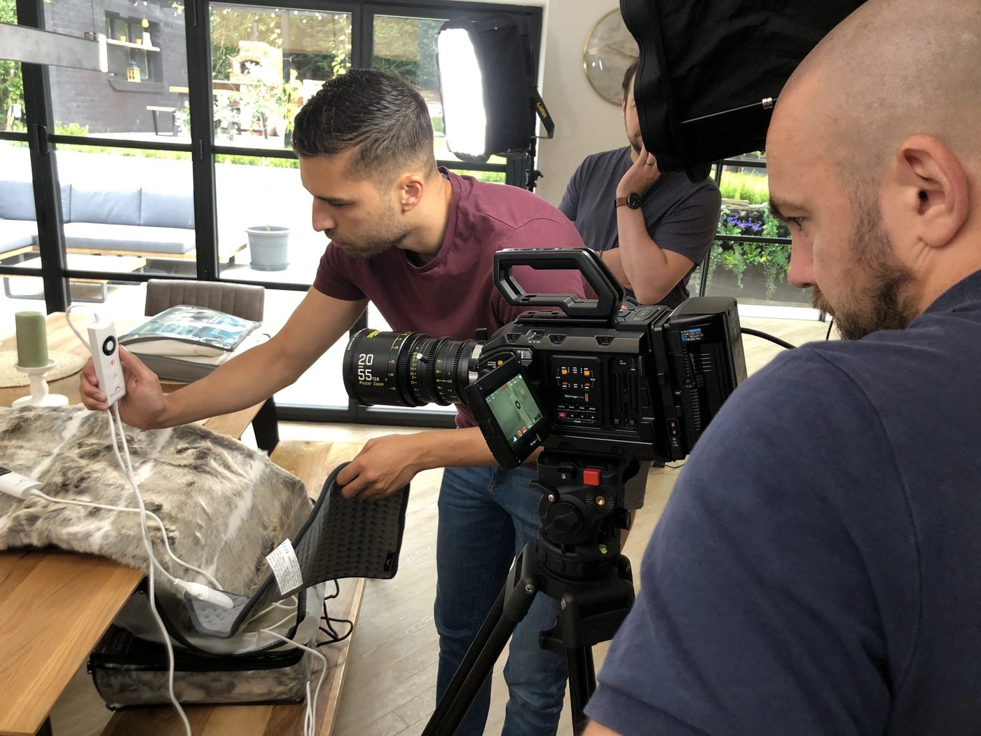 Yellow crew filming a homewares product demonstration in a bright kitchen setting
